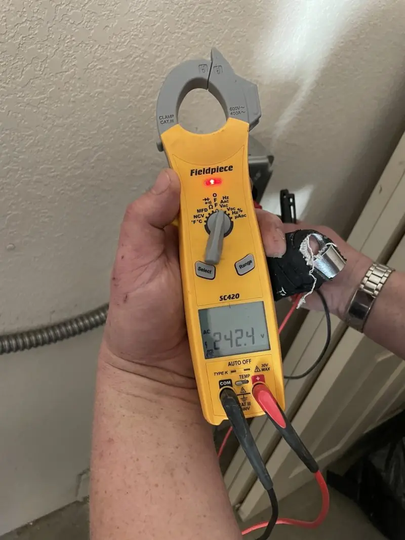 Voltage testing with clamp meter during Outlet Installation in Johnson City